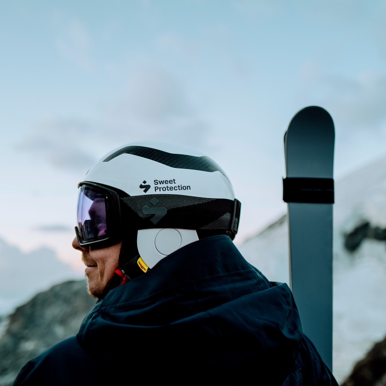 Person wearing helmet and goggles for skiing